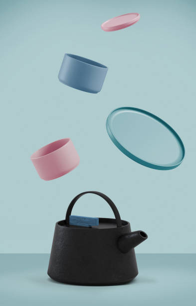 istock Modern black cast iron teapot with levitation cups, artistic colors background set, art set for tea time. 3d rendering. 1236748088