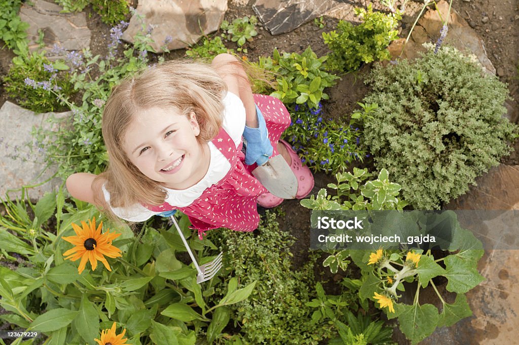 Little gardener Little girl working in herbal garden Adult Stock Photo