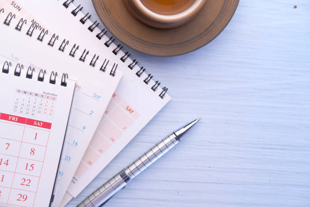istock deadline concept with stack of coins and pen on table 1236803842