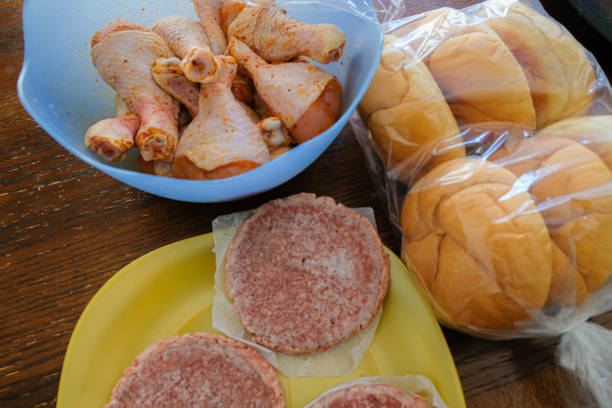 istock Frozen Raw Beef Burger Patties prepared for Barbeque Grill 1236807346