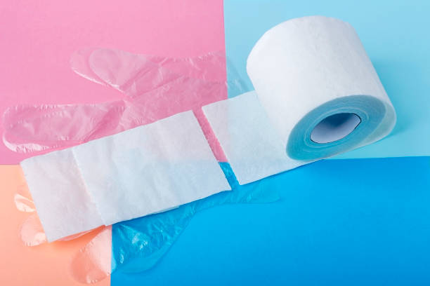 istock White toilet paper roll and disposable plastic gloves on colored background. Copy space for text, flat lay. Hygiene products. Protection during the coronavirus epidemic. 1236807487