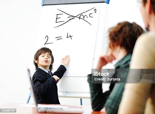 Genius Kid On Business Presentation Speaking To Adults Stock Photo - Download Image Now