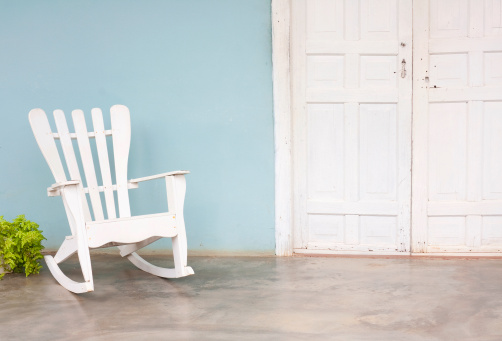 Image of a traditional white chair on a veranda.  Image shot in Vinales, Valle de Vinales, Pinar del Rio, Cuba.