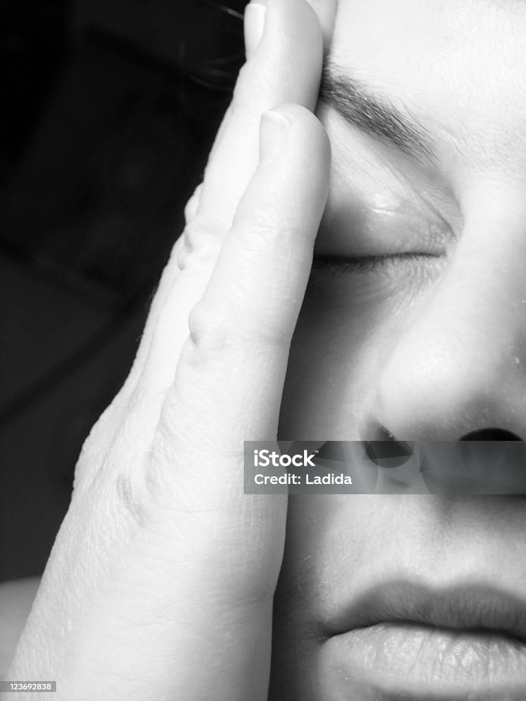 Headache woman holding her head, suffering from headache (soft focus) Concussion Stock Photo