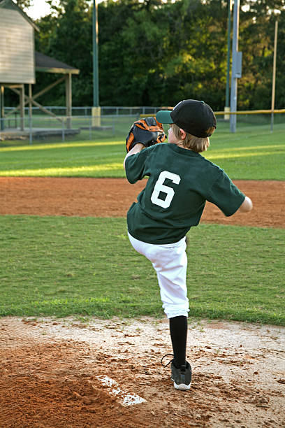 istock Little league boy pitcther. Baseball field, mound, player. Pitching. 123693499