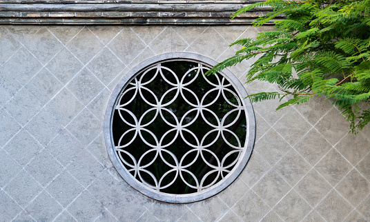 Chinese style window and green tree.