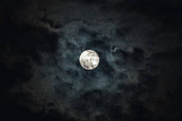 istock Full moon and shine behind the fog 1236997336
