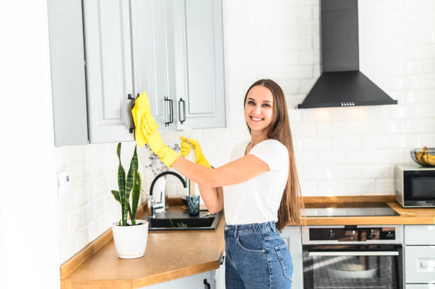 istock Young woman in rubber gloves doing house cleaning 1237007618