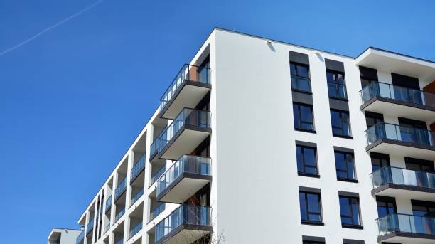 istock Modern condo building with big windows and modern facade. 1237035770