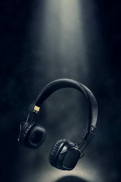istock Wireless on-ear headphones on black background 1237060358