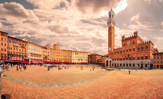 Panorama of Piazza del Campo (Campo square), Palazzo Pubblico and Torre del Mangia (Mangia tower) in Siena, Tuscany, Italy.