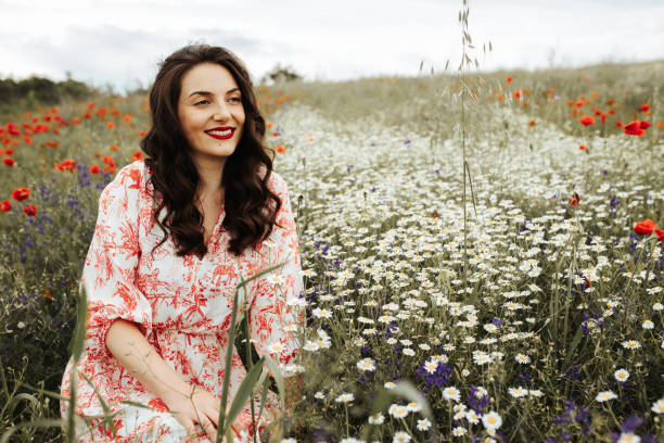 istock Young female beauty in the white fields of chamomile 1237104897