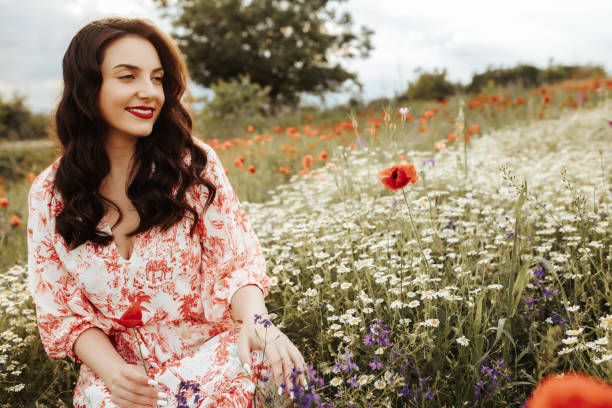 istock Young female beauty in the white fields of chamomile 1237105929