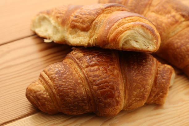 istock French croissants on a wooden board. 1237118810