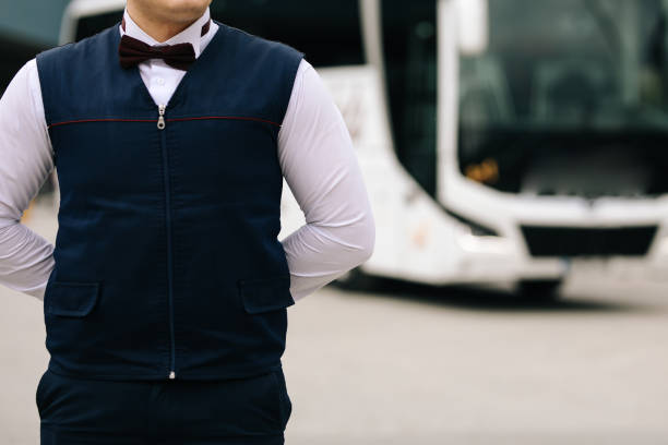 istock Male bus driver standing in front of a passenger bus 1237134182
