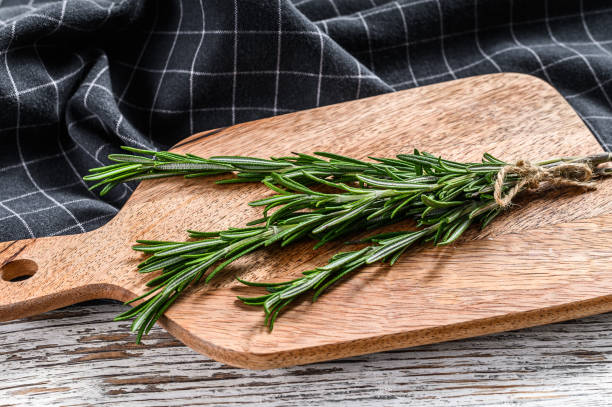 istock Organic rosemary. A bunch of fresh herbs. White background. Top view 1237136736