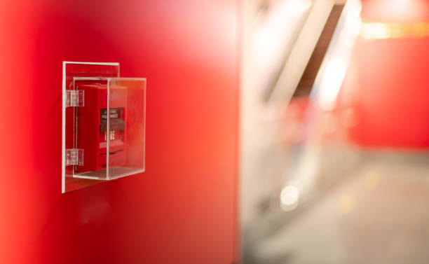 istock The red fire alarm switch on the red wall at the Bangkok subway. 1237142554