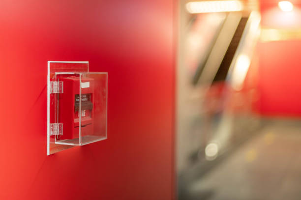 istock The red fire alarm switch on the red wall at the Bangkok subway. 1237142561