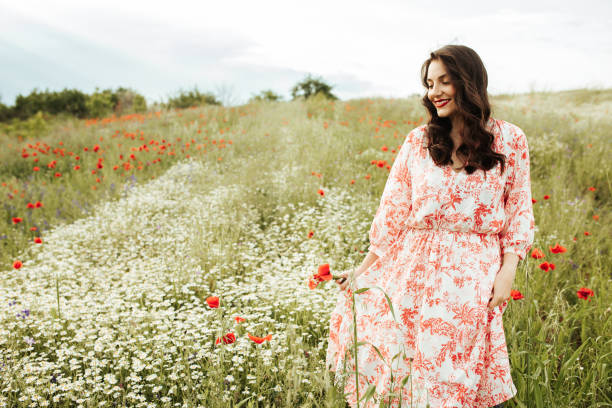 istock Young female beauty in the white fields of chamomile 1237148746