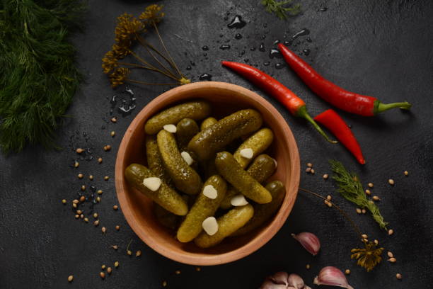 istock Homemade small  cucumbers, fermented, salted or marinated pickles with garlic, chili and dill 1237151633