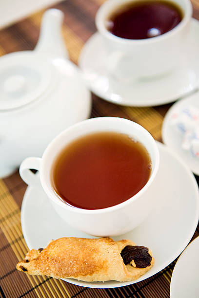 Cup of tea with biscuits stock photo