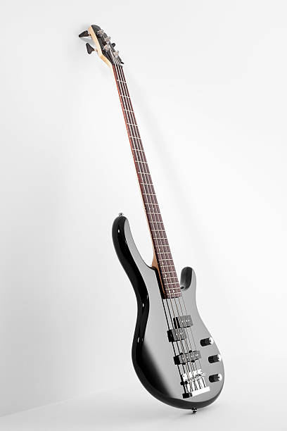 Bass guitar on white background Bass guitar on white background bass guitar stock pictures, royalty-free photos & images