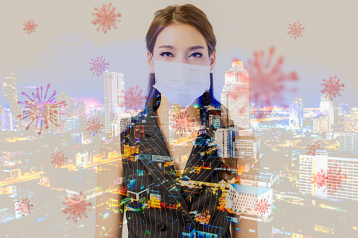 Double exposure of young asian woman wearing hygienic mask to prevent infection with smart city. Protection against contagious disease coronavirus concept. Airborne respiratory illness such as flu.