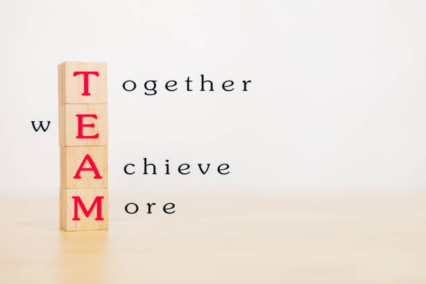 istock Motivation and Teamwork concept. Wooden block stack up and word TEAM on wooden table. With copy space for your text. 1237245018