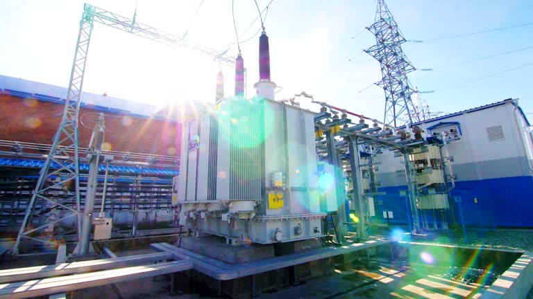 modern electrical transmission substation against blue sky