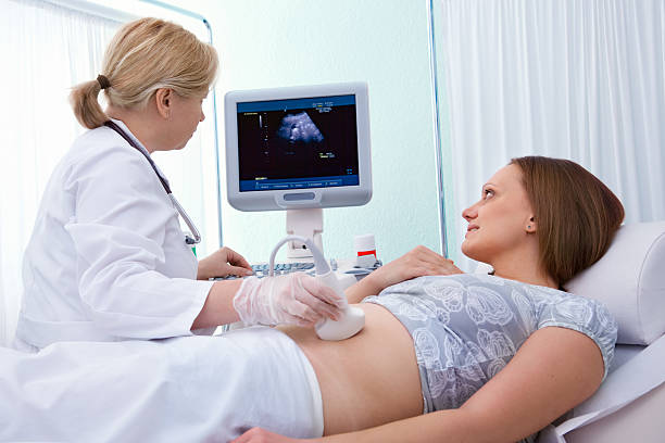 istock Female doctor diagnosing pregnant woman 123725698