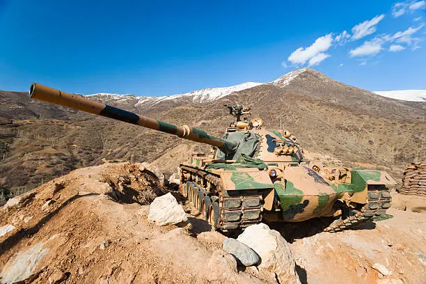 M60 Army tank in battlefield.