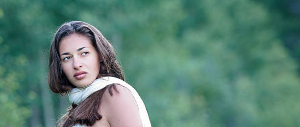 istock Beautiful young woman looking over shoulder 123727426