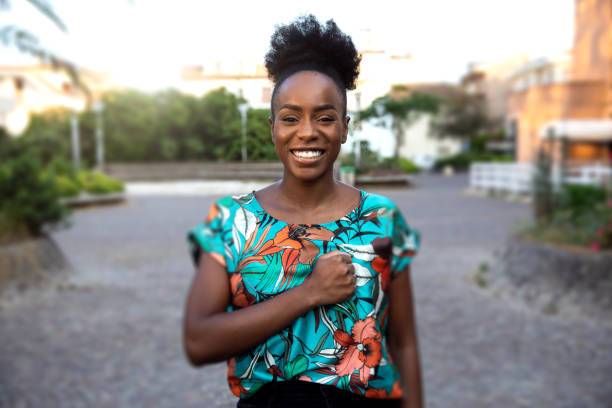 istock Woman waving to a friend avoiding handshake and hugs 1237291594