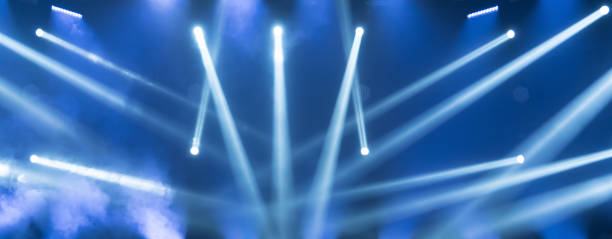 istock Concert live streams available online. Show must go on. Stage for musicians. Online event. Empty stage with blue spotlights. Blue stage lights. 1237295335