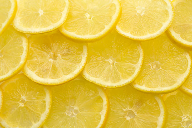 istock Slices of lemon background 123731881
