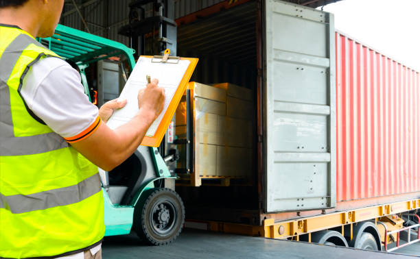 istock Warehouse worker courier holding clipboard with control load shipment goods 1237319865