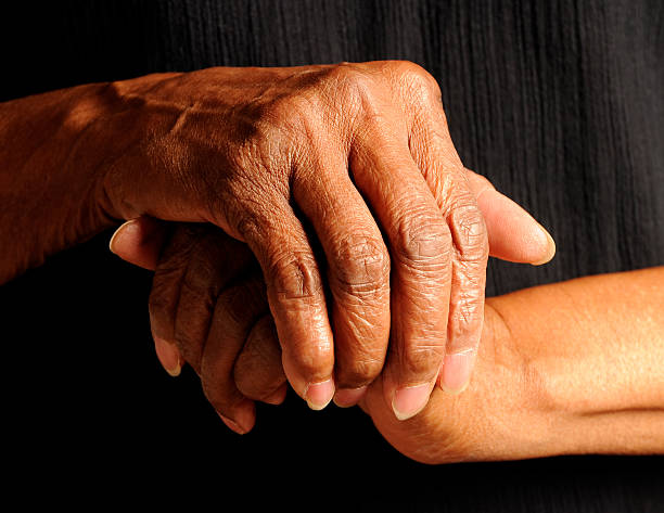 istock Hands of a  An African America Senior Isolated on Black 123732047