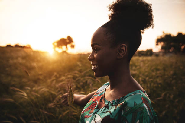 istock Woman with open arms breathing in the nature 1237335253