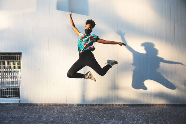 istock Woman jumping in the air 1237335764