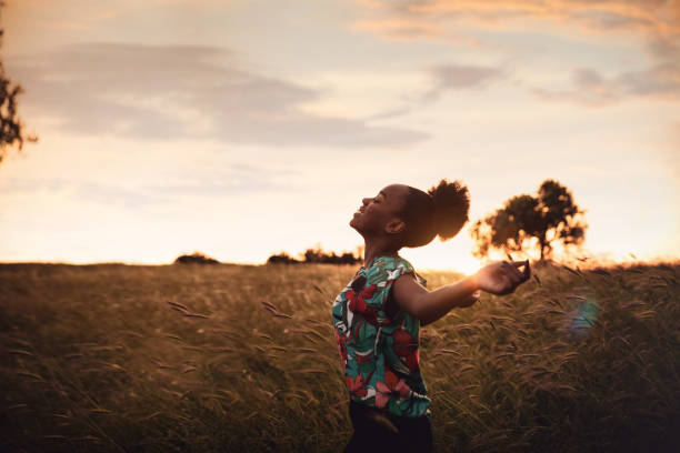 istock Woman with open arms breathing in the nature 1237344091