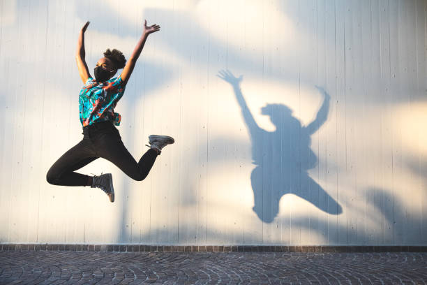 istock Woman jumping in the air 1237346713
