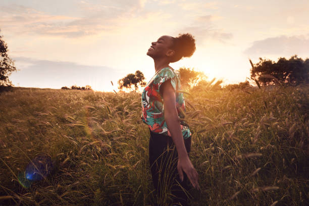 istock Woman with open arms breathing in the nature 1237347743