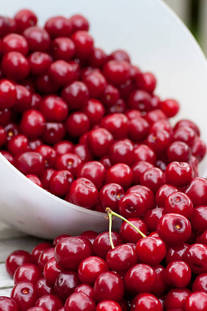 Cherries in a dish Red fresh sweet cherries in a white dish aromatisch stock pictures, royalty-free photos & images