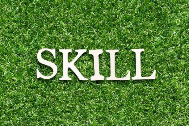 istock Wood alphabet letter in word skill on artificial green grass background 1237352462