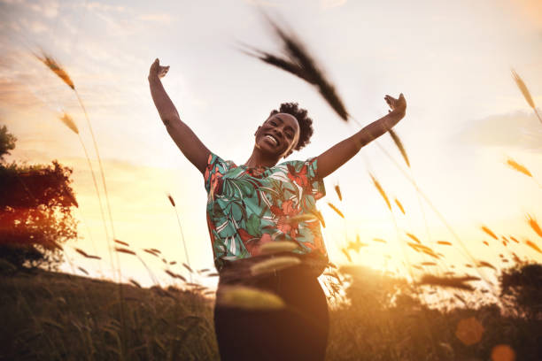 istock Woman with open arms breathing in the nature 1237358128