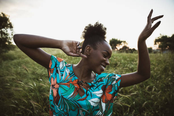 istock Woman with open arms breathing in the nature 1237358651