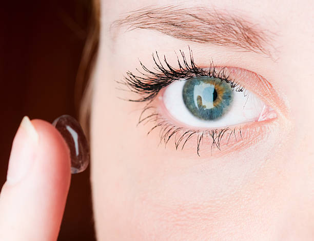 istock Close up of inserting a contact lens in female eye 123736867