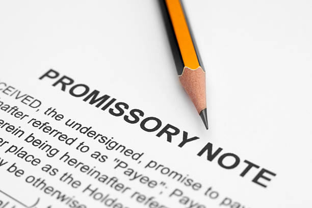 Close-up of a Promissory Note and a sharpened pencil stock photo