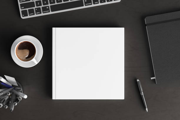 Book cover mock up. Workspace on wooden desk with cup of coffee