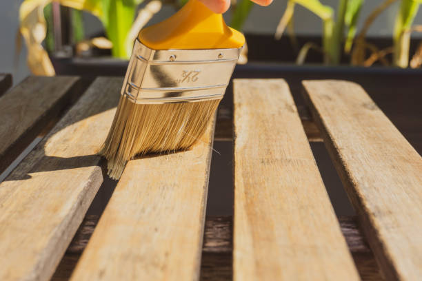 istock Varnishing outdoor teak table. Balcony table. Colorless varnish. 1237425497